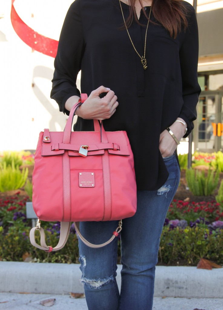 Pink Purse and black blouse