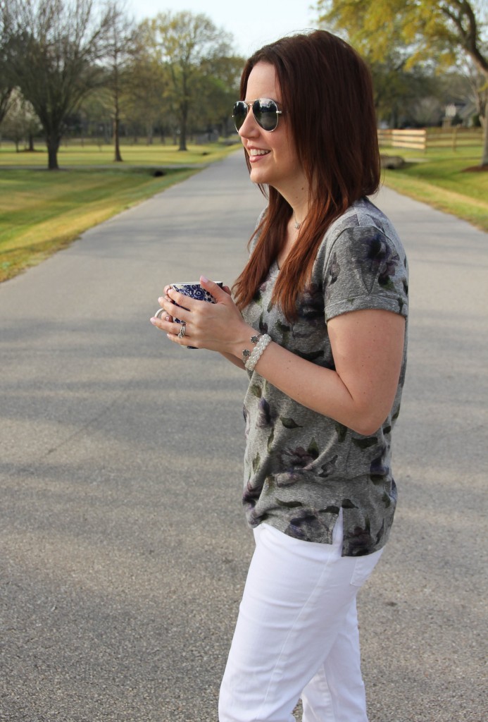 coffee cup, gray floral tee and white denim