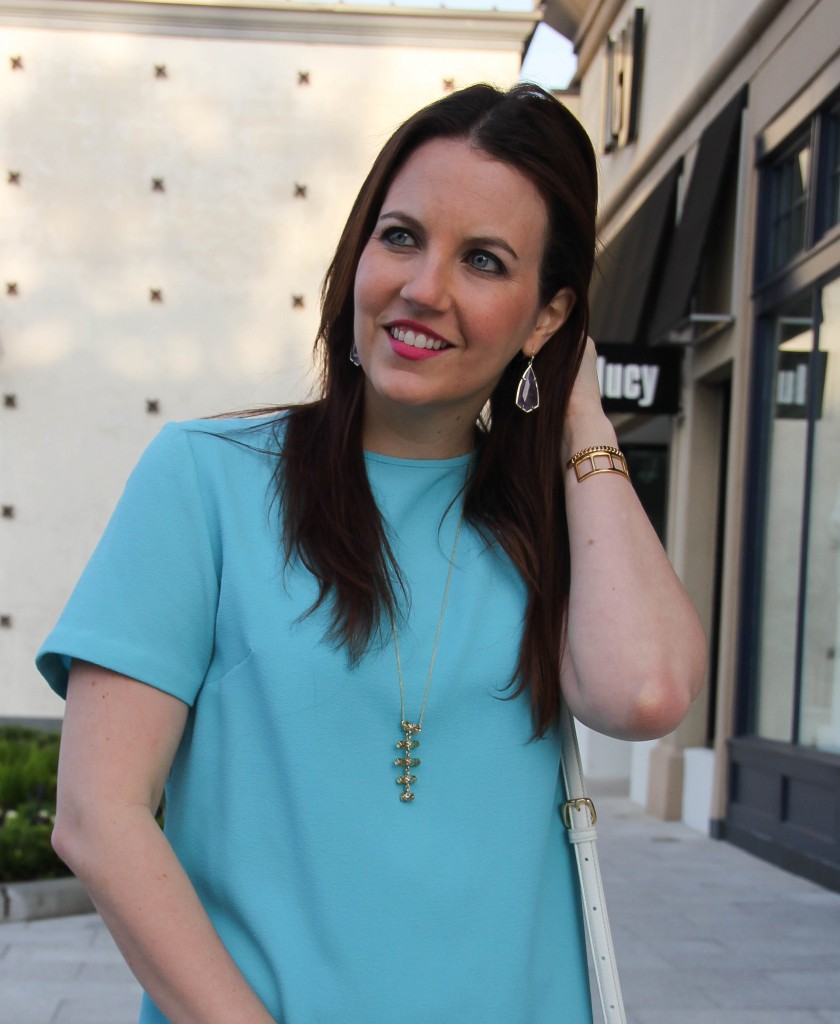 gold pendant necklace with kendra scott earrings