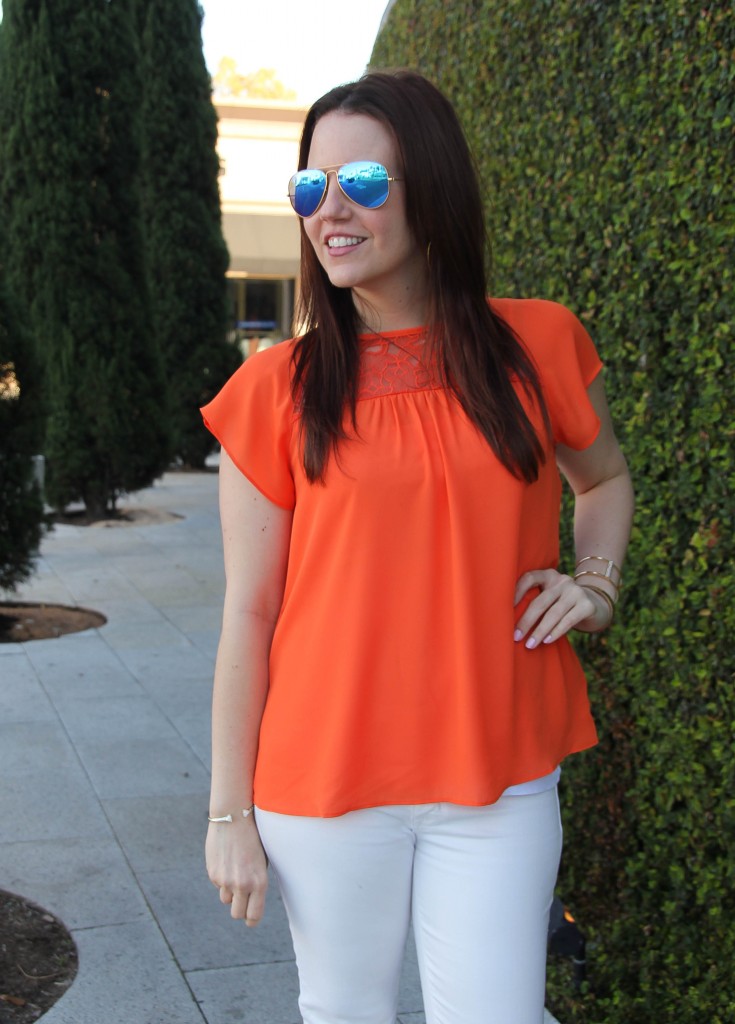 summer orange top with white skinny jeans