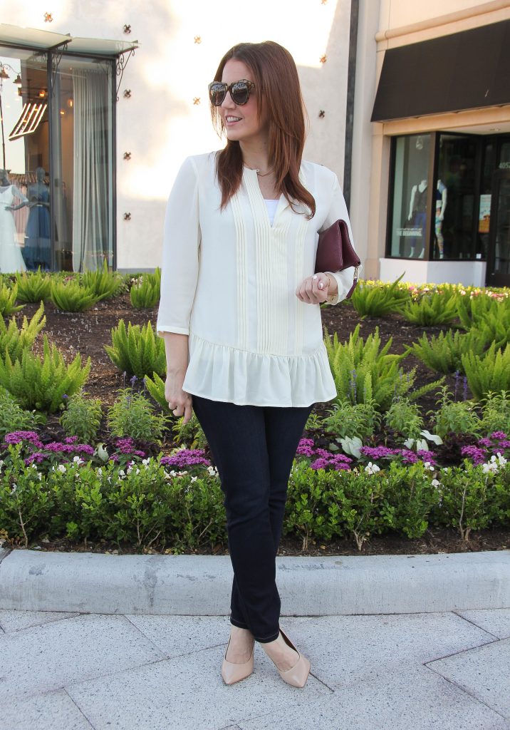 fall outfit - ruffle blouse and dark jeans with heels