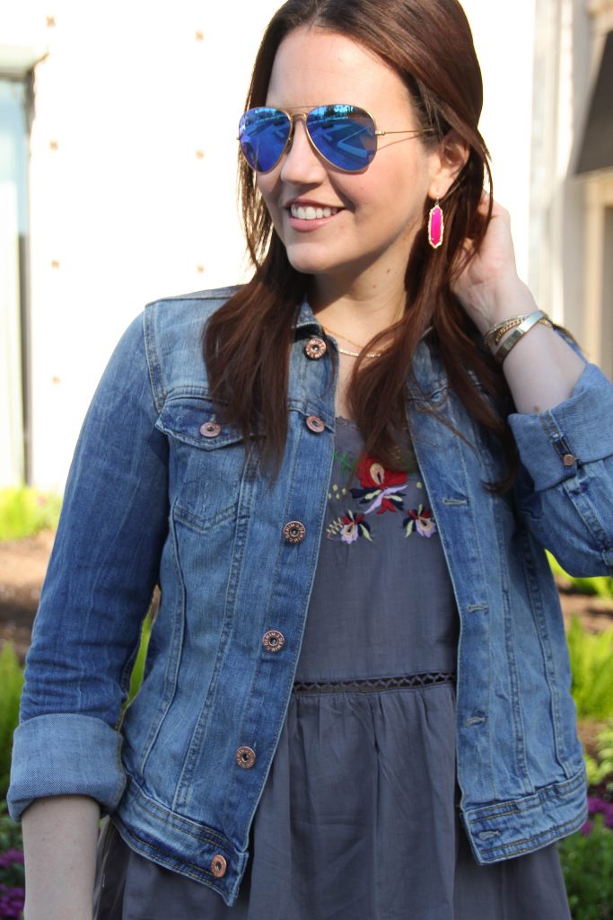 pink kendra scott earrings and blue mirrored aviators