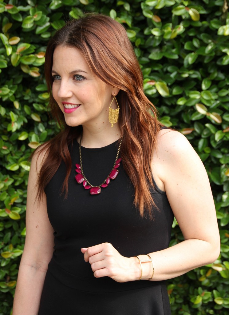 gold fringe earrings and maroon necklace