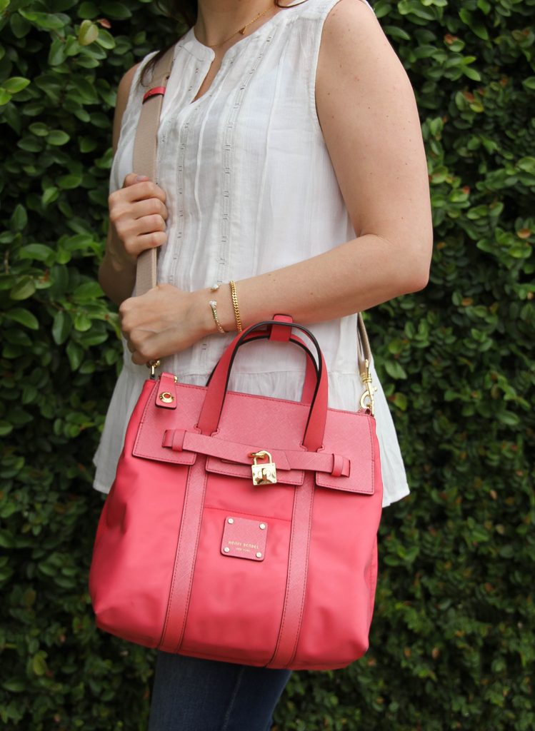 sleeveless white blouse and pink crossbody bag