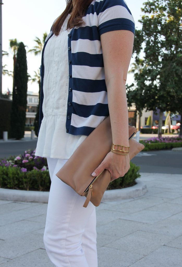 clare v foldover clutch and gold bracelets