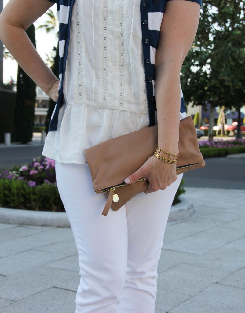 foldover clutch with an all white outfit for work