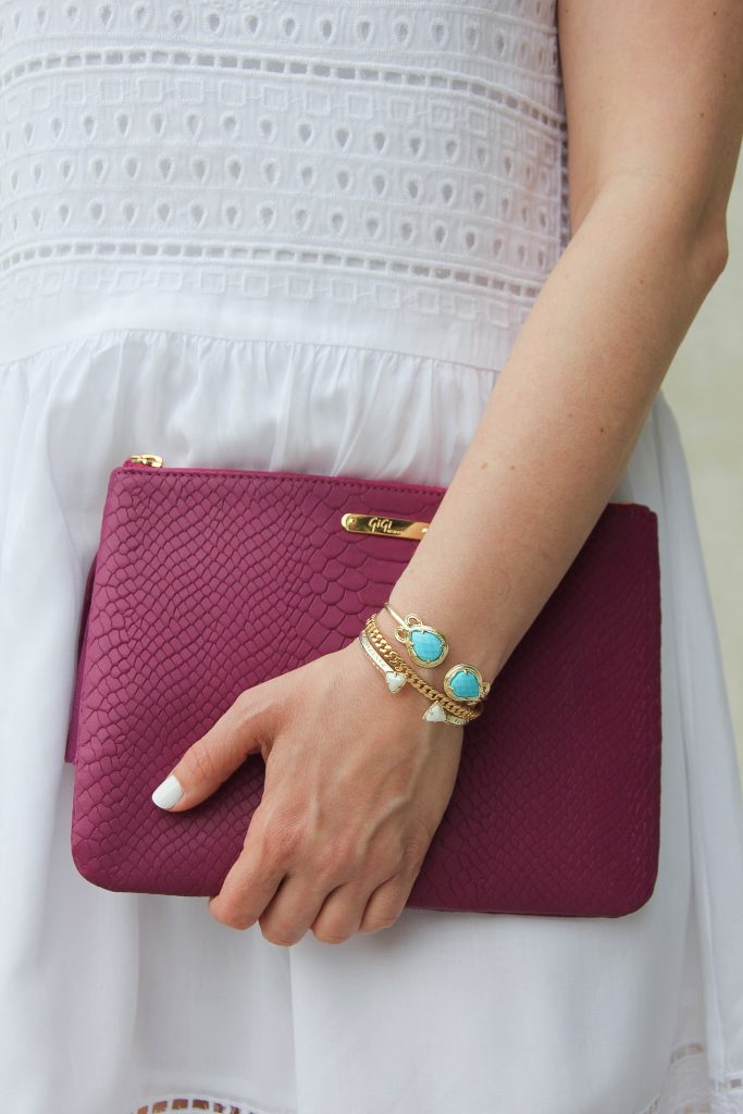 kendra scott turquoise bracelet and pink purse