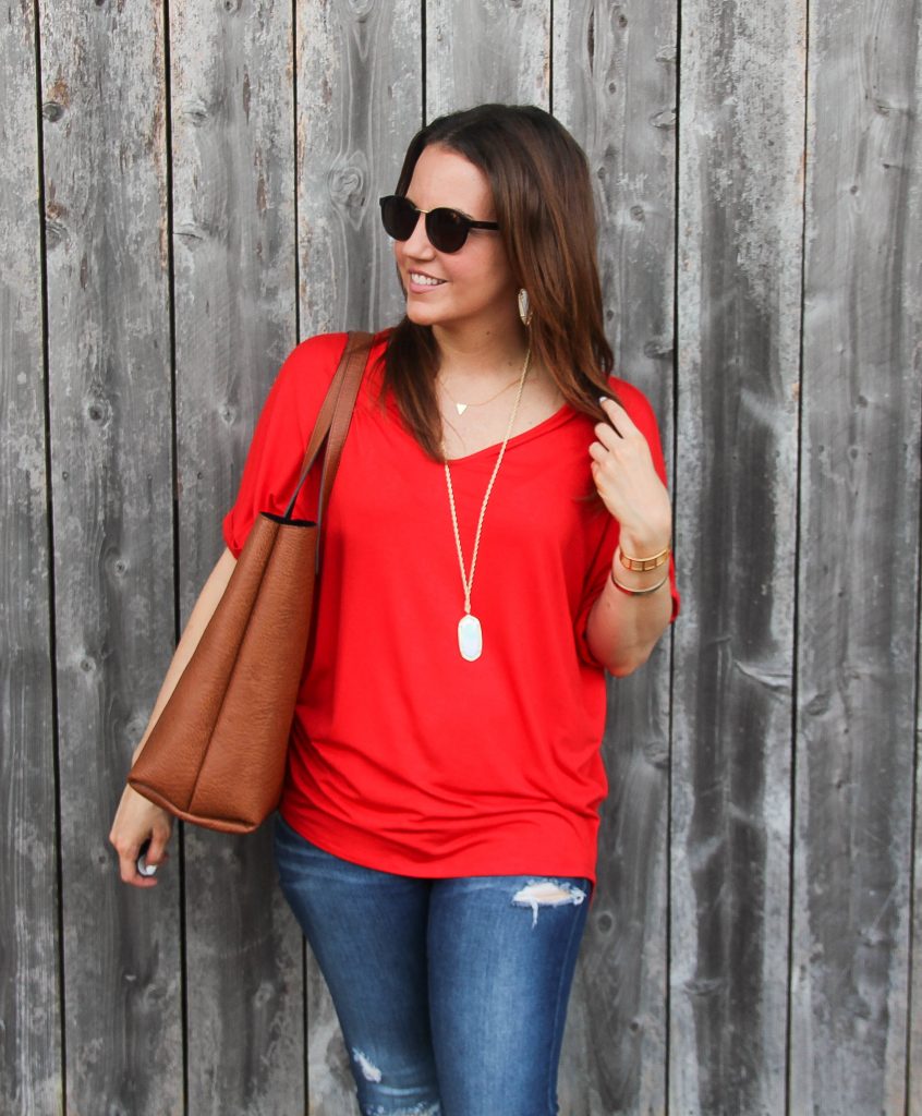 Red piko tee and brown tote bag