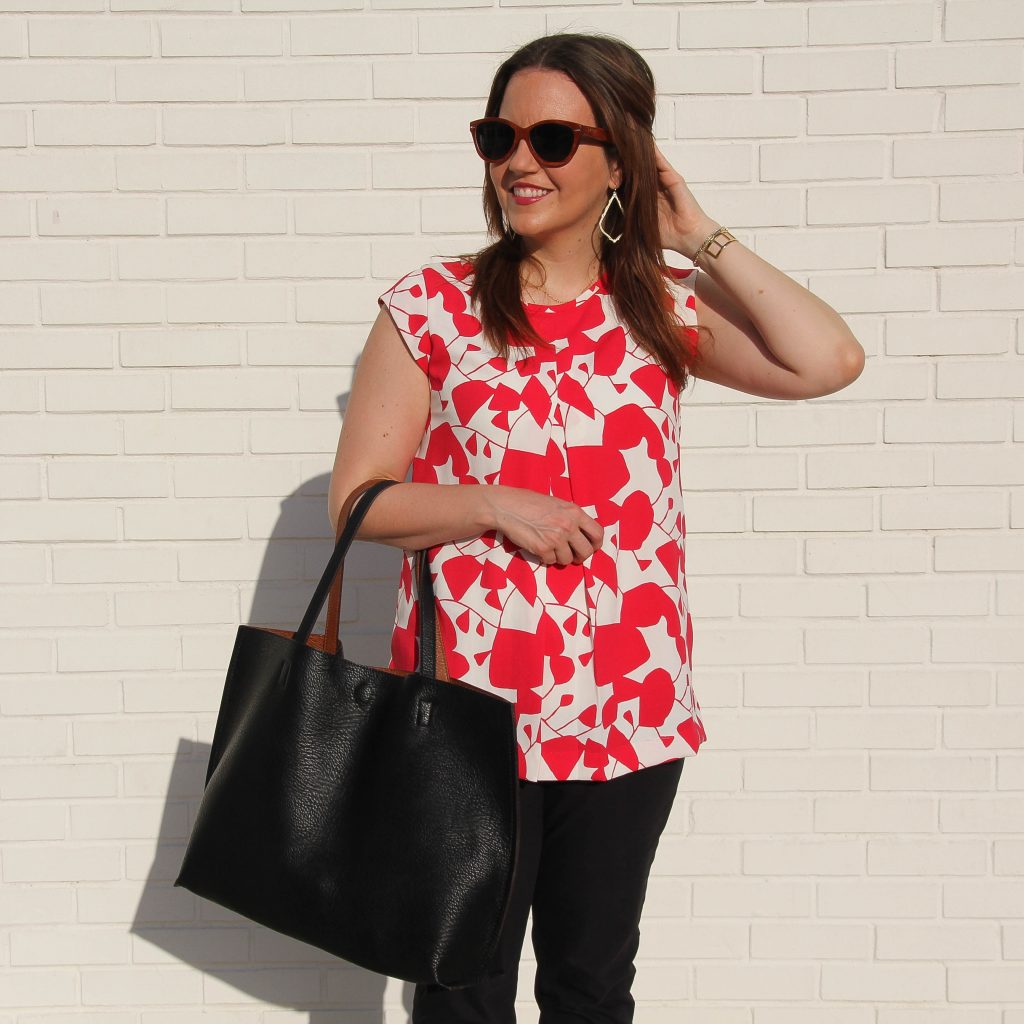 Red and White Sleeveless blouse with gold hoop earrings