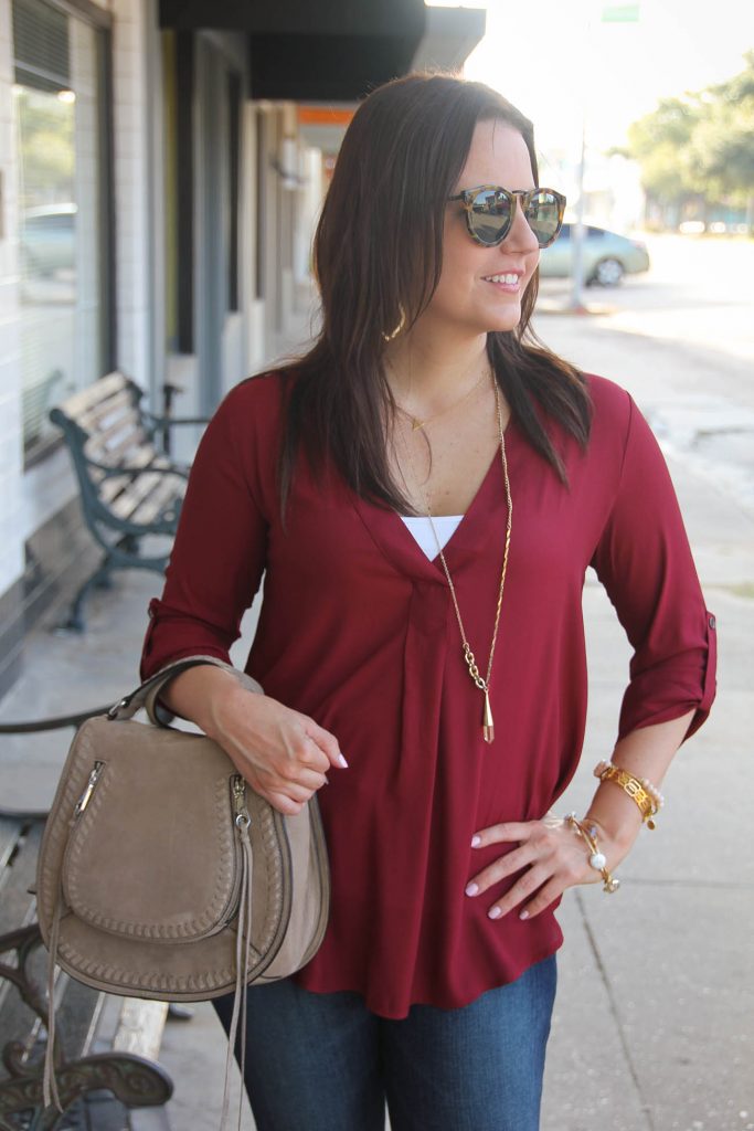 burgundy blouse with gold jewelry