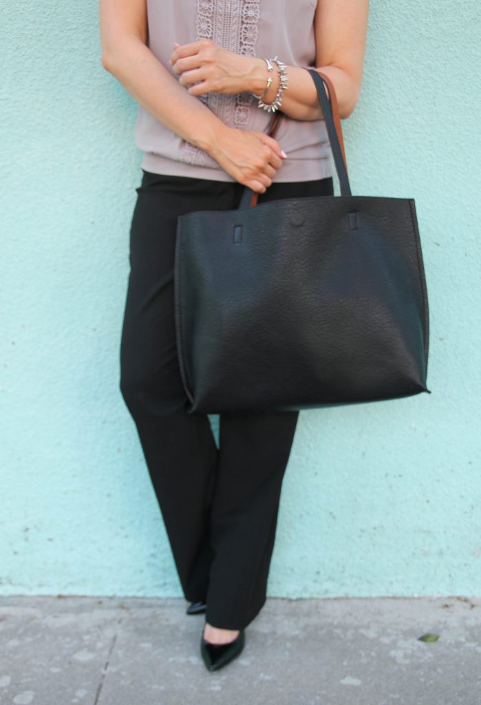 black trousers and black tote bag