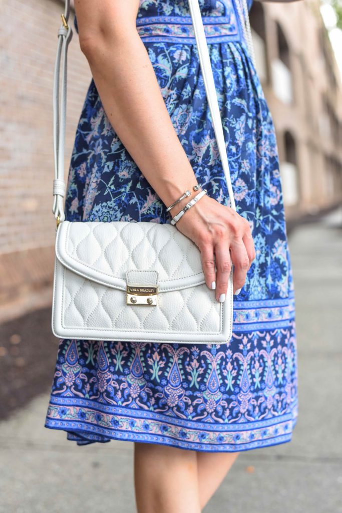 white quilted crossbody bag and cute silver bracelets