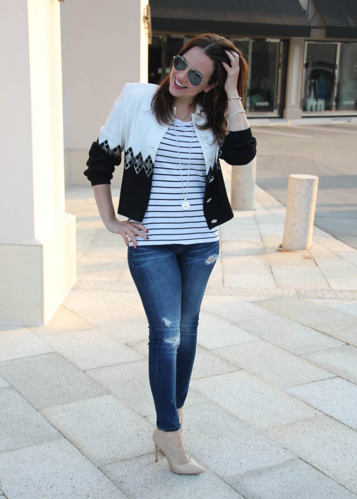 Karen Rock of LadyinViolet wears a striped tee and distressed jeans casual outfit paired with a sequin vintage jacket.