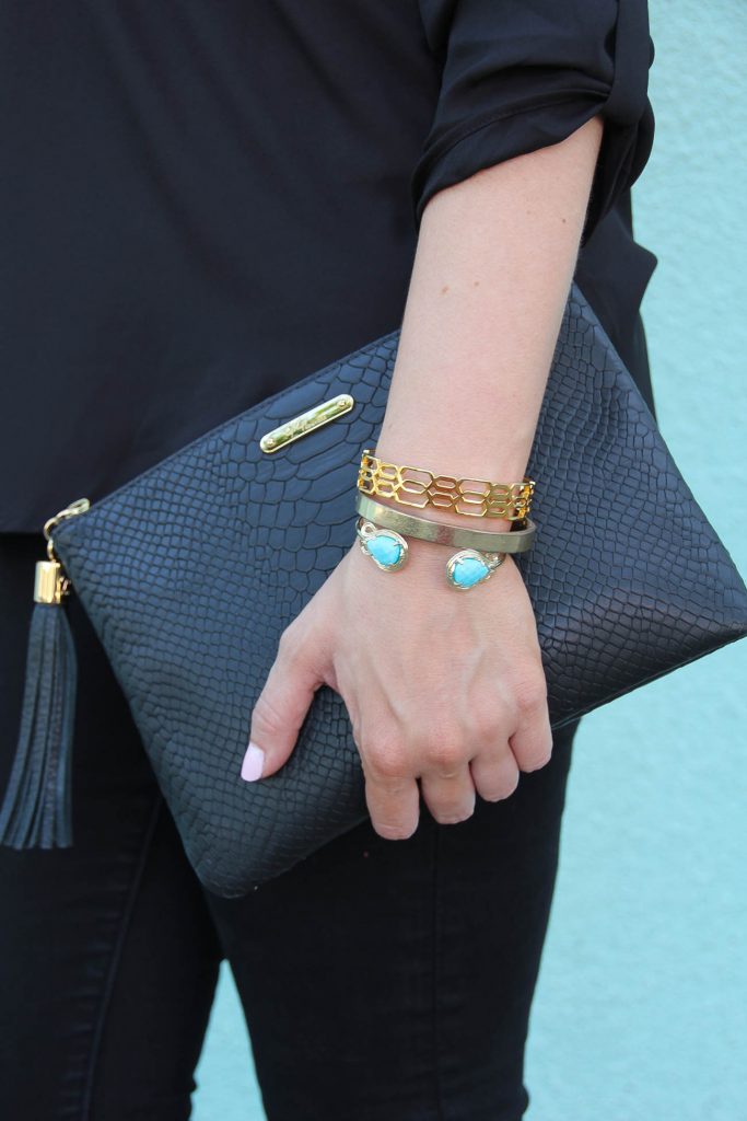 cute gold bracelet stack and gigi ny black clutch