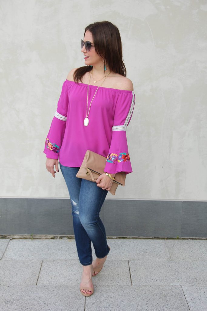 LadyinViolet shares some Houston street style in a bell sleeve blouse and distressed jeans.