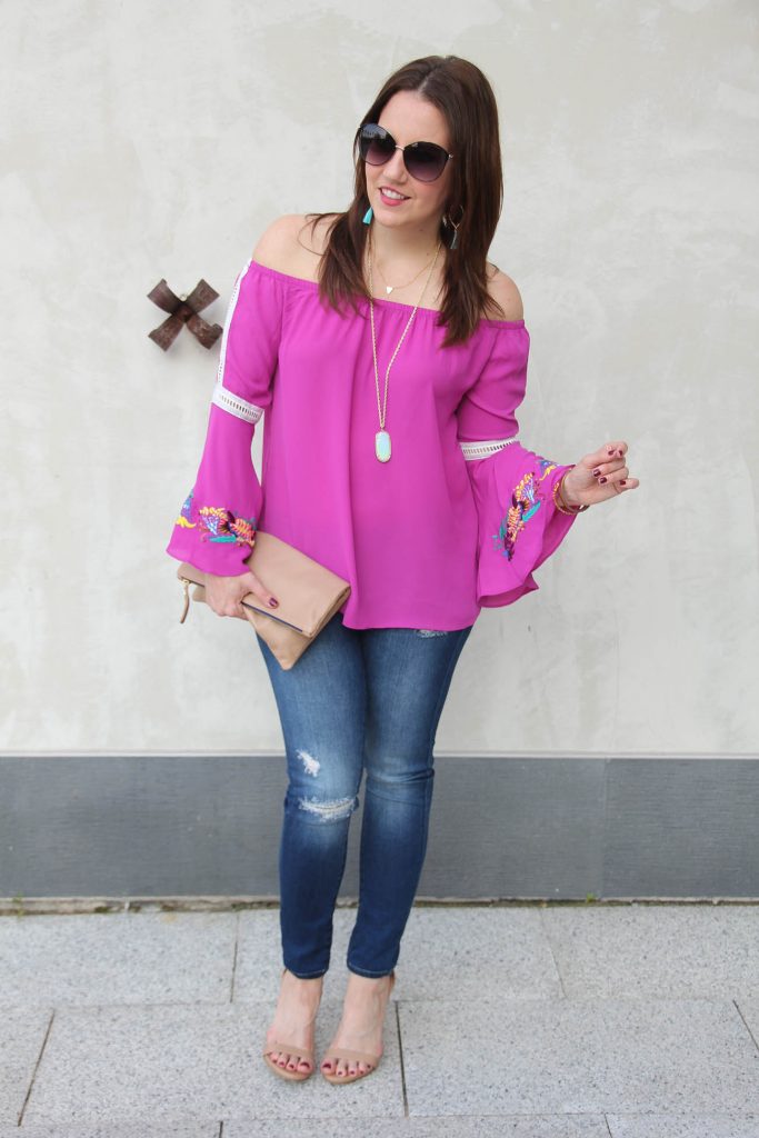 Fashion Blogger Casual Weekend Outfit in distressed skinny jeans and a pink bell sleeve top.