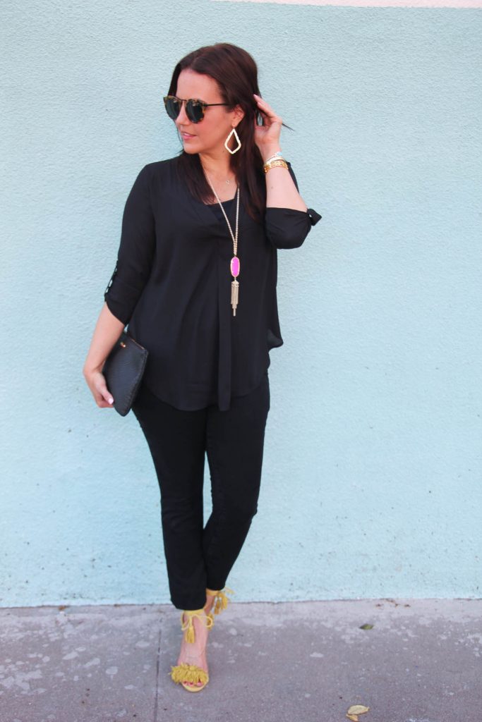 Houston Fashion Blogger wears a chic all black outfit with colorful jewelry.