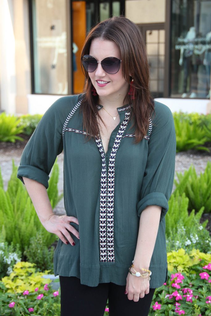 Houston Fashion Blogger creates a fall fashion outfit featuring an olive tunic