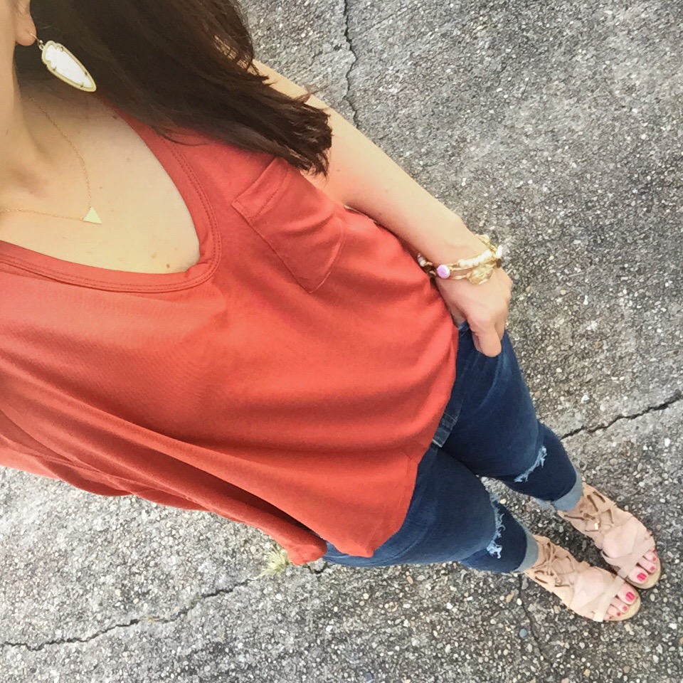 casual weekend outfit idea - orange top distressed jeans