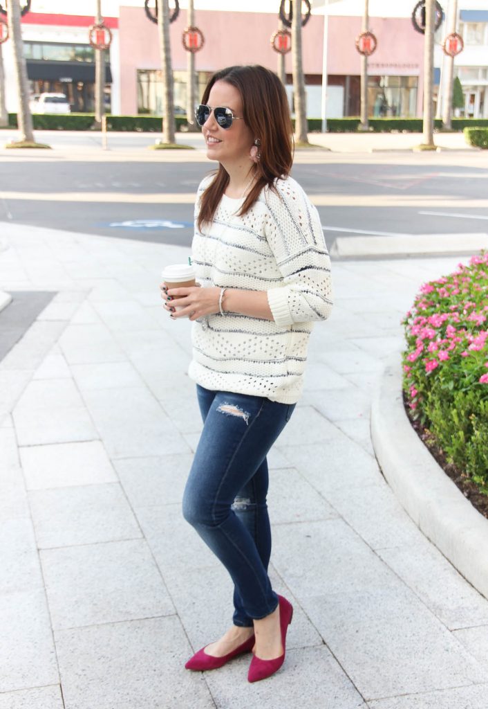 Houston Fashion blogger styles a casual Thanksgiving outfit idea with a sweater.