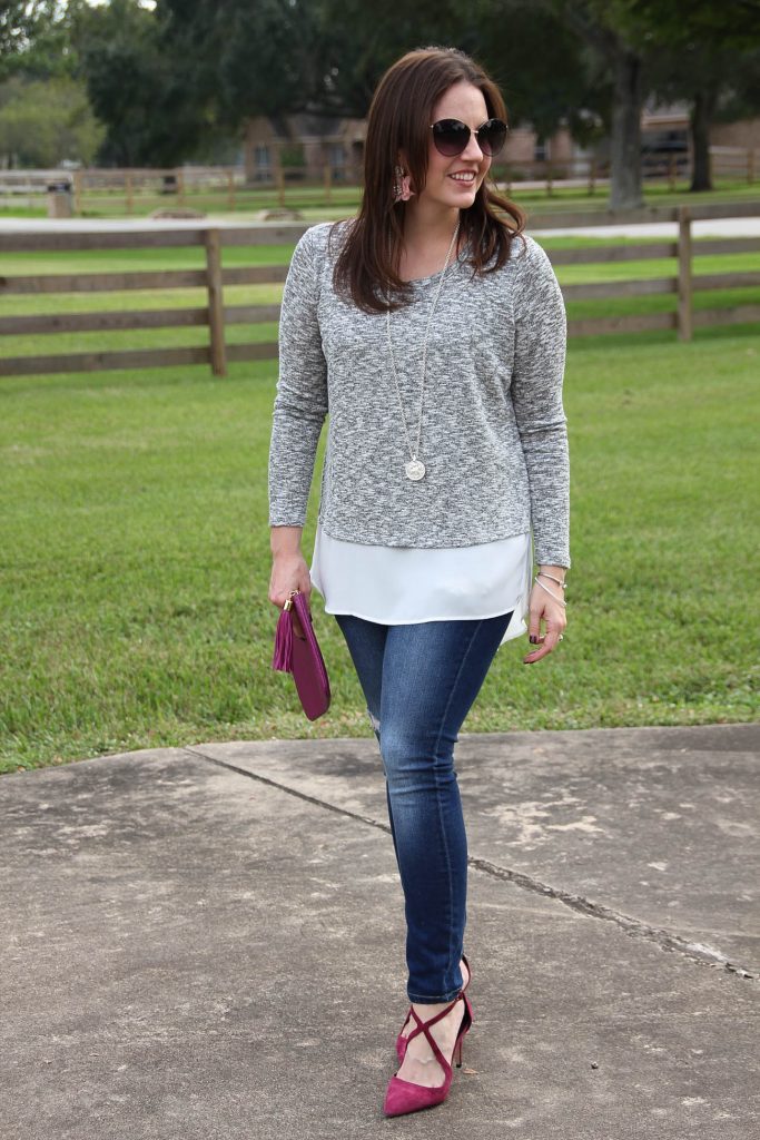 Fall outfit idea featuring a faux layered sweater and distressed skinny jeans.