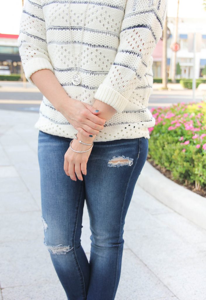 LadyinViolet wears a nordstrom fall outfit idea with a striped sweater and distressed jeans.