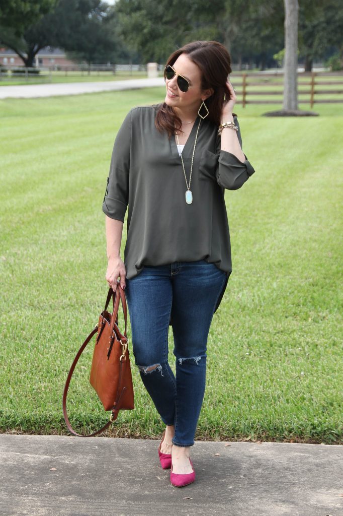 Houston Style Blogger shares a fall weekend outfit including an olive tunic and distressed jeans with pink suede flats.