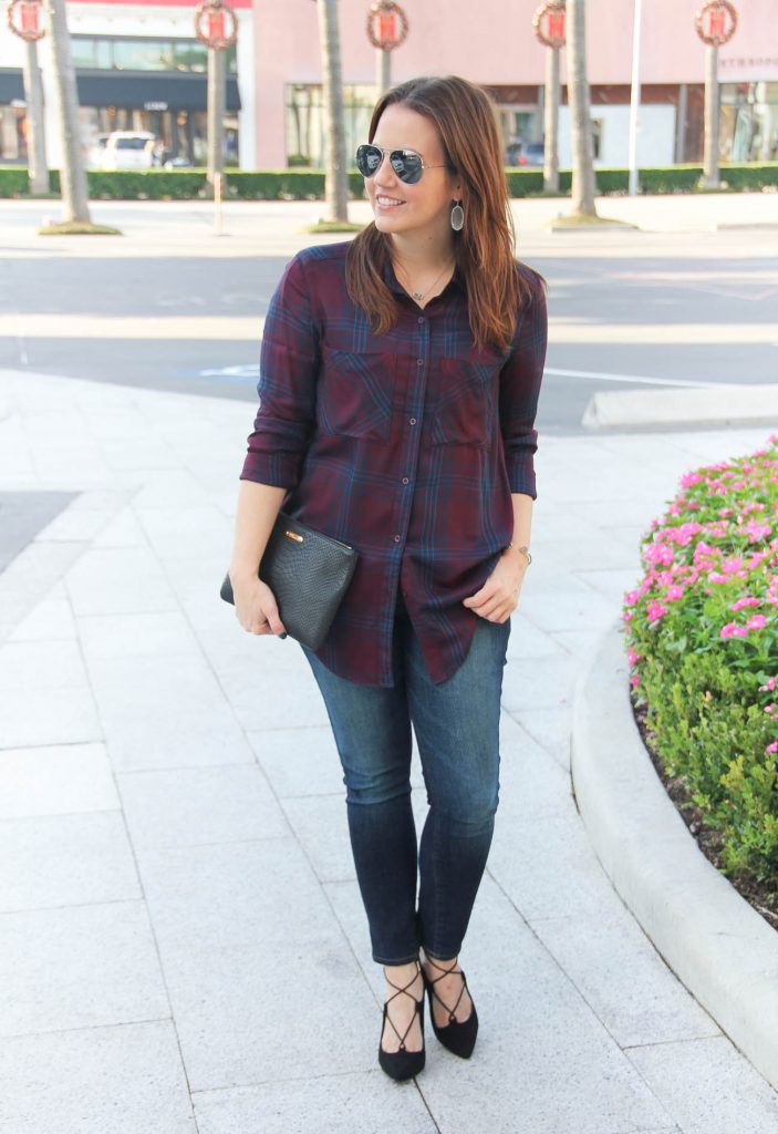 Houston Fashion Blogger styles a fall outfit idea wearing dark plaid tunic and skinny jeans.