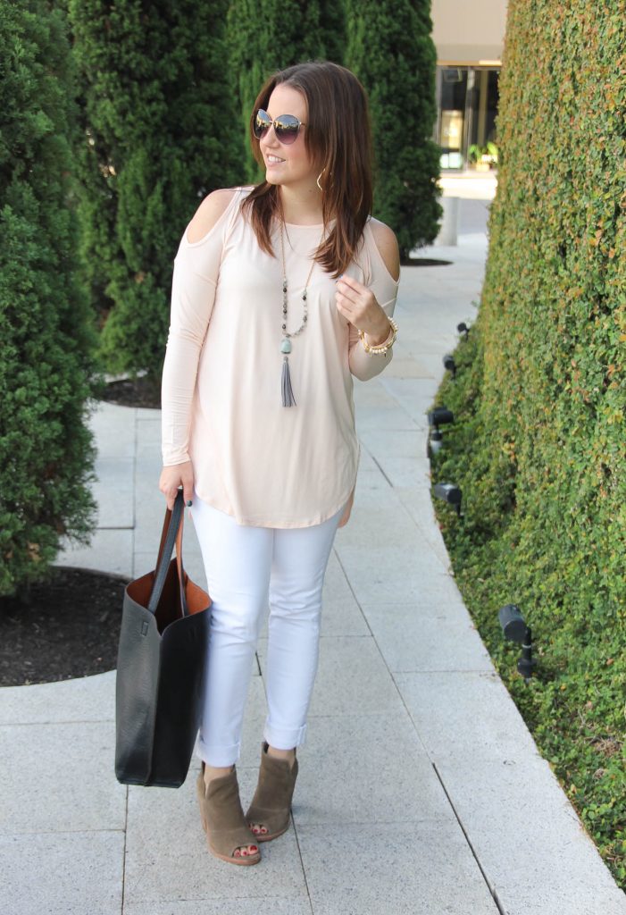 Houston Fashion blogger wears a fall weekend outfit blush cold shoulder top with white jeans and booties.