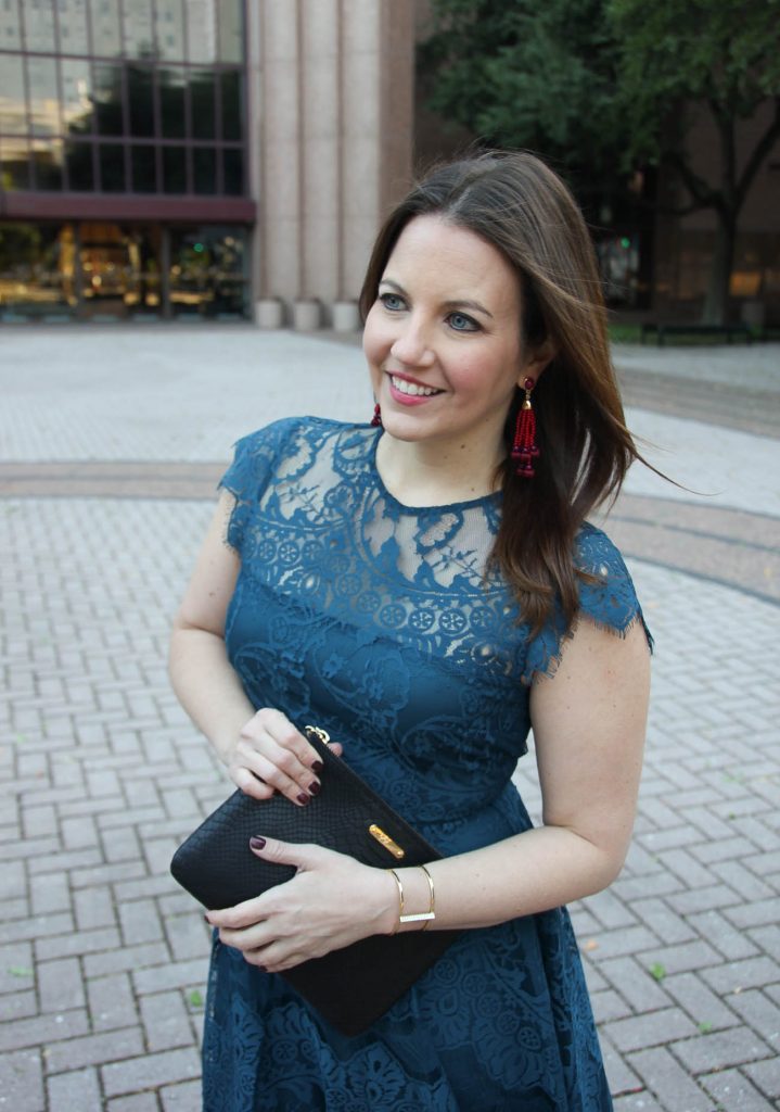 Houston Style blogger, Lady in Violet wears a Christmas party dress in teal lace with red earrings.