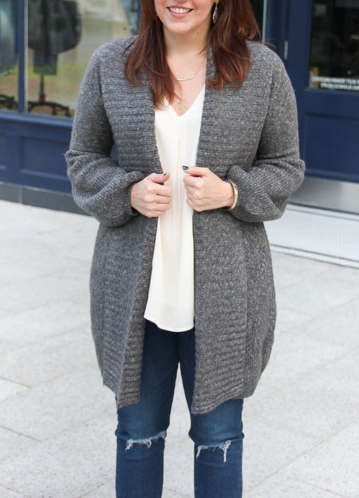 Houston Fashion Blogger, Lady in Violet wears a long gray cardigan with bell sleeves and a gold bangle bracelet.