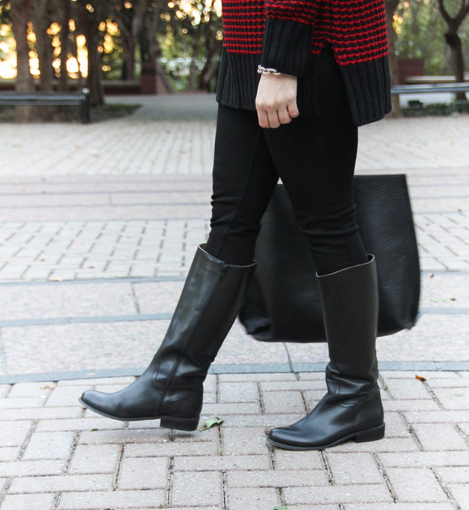 Houston Style Blogger, Karen Rock wears black riding boots with stretchy black skinny jeans.