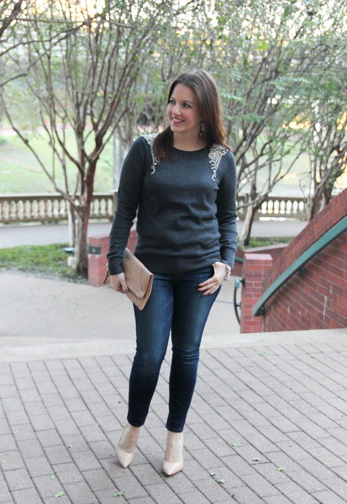 Houston Fashion Blogger Karen Rock wears a fall outfit idea featuring an embellished sweater and skinny jeans with heels.