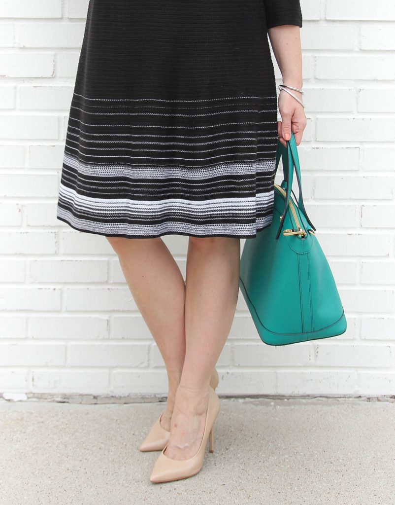 Texas Fashion Bloggers styles a striped knit dress for work.