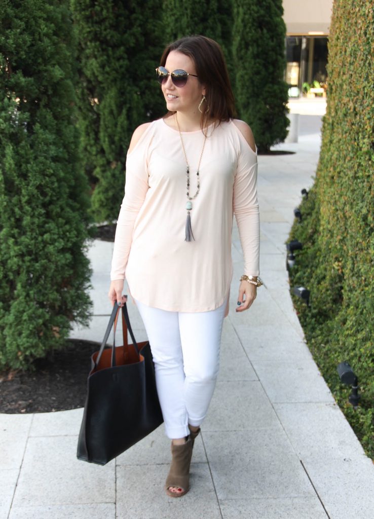 Houston Fashion Bloggers wears a casual weekend outfit including white jeans and a cold shoulder pink top.