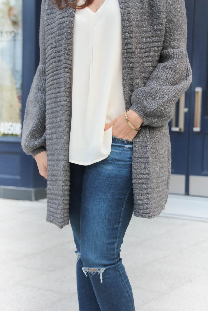 Houston Fashion blogger wears a layered casual outfit idea for winter with a long cardigan and white tank.