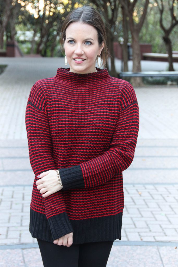 Karen Rock of the Houston fashion blog, Lady in Violet wears a comfy red sweater that is perfect for Christmas Day.