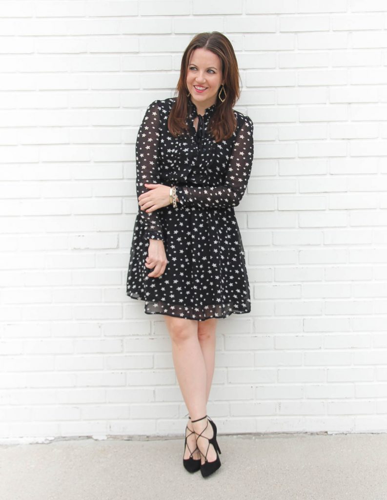 Houston Fashion Blogger, Lady in Violet styles a holiday party outfit idea with a star print dress and black lace up heels.