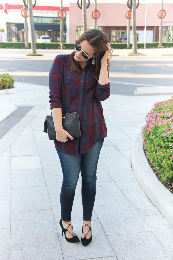 Houston Fashion Blogger wears a Thanksgiving outfit idea including a plaid top and lace up heels.