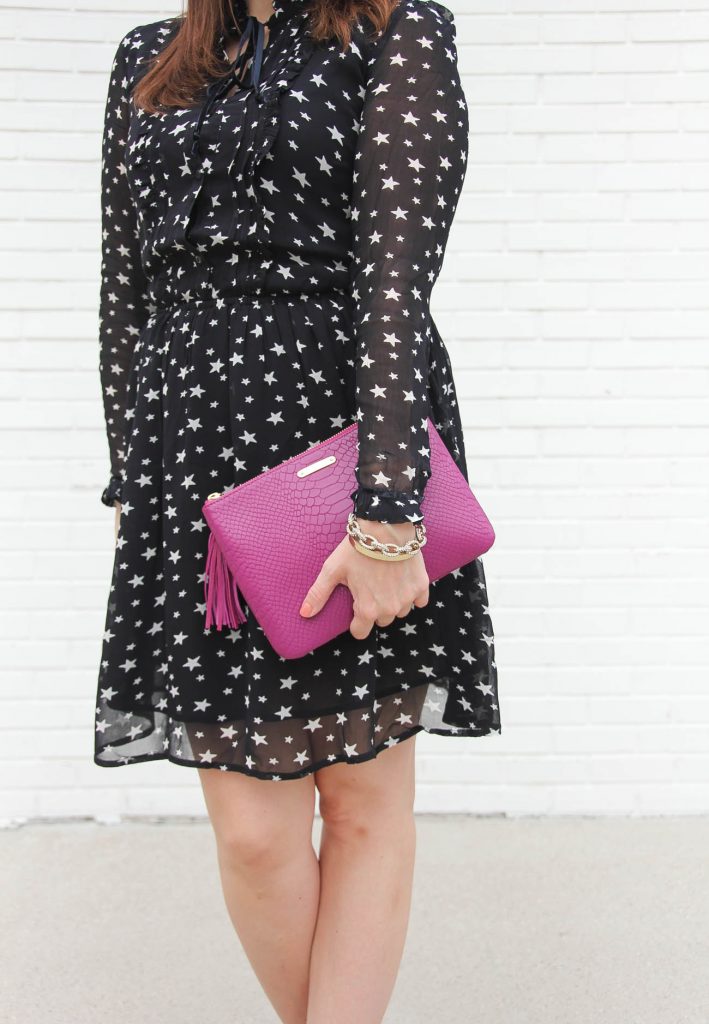 Houston Fashion Blogger, Karen Rock wears a cute long sleeve star print dress for a holiday party.