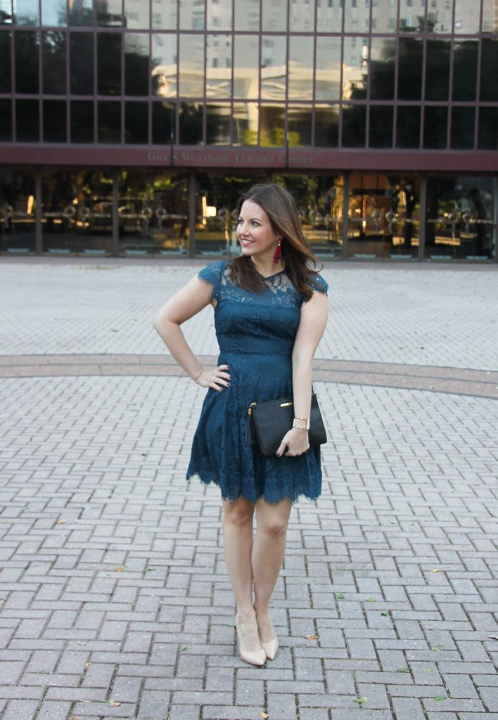 Houston Fashion Blogger Lady in Violet styles a Holiday outfit idea in a teal lace dress from Nordstrom with heels and red earrings from Baublebar.