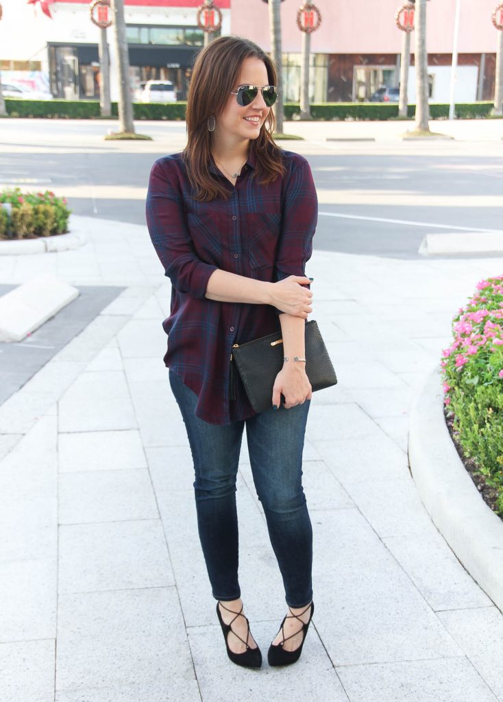 Houston Fashion Bloggers styles a fall weekend outfit featuring a plaid blouse and skinny jeans with heels.