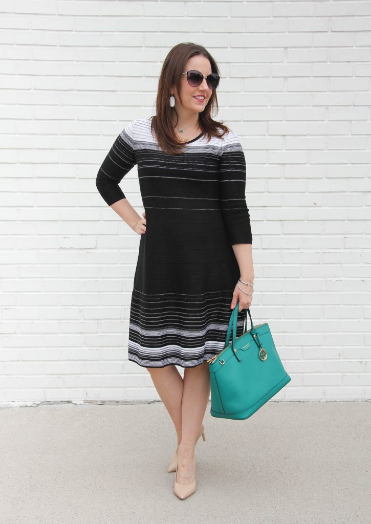Houston fashion blogger styles a black sweater dress for the office.