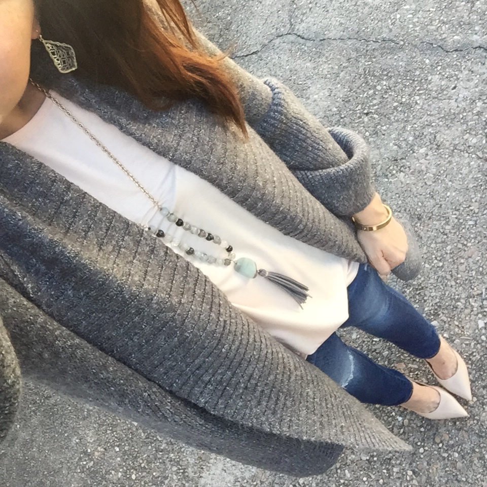 Houston fashion blogger Lady in Violet styles a winter casual outfit with a gray long cardigan and distressed jeans under 100.