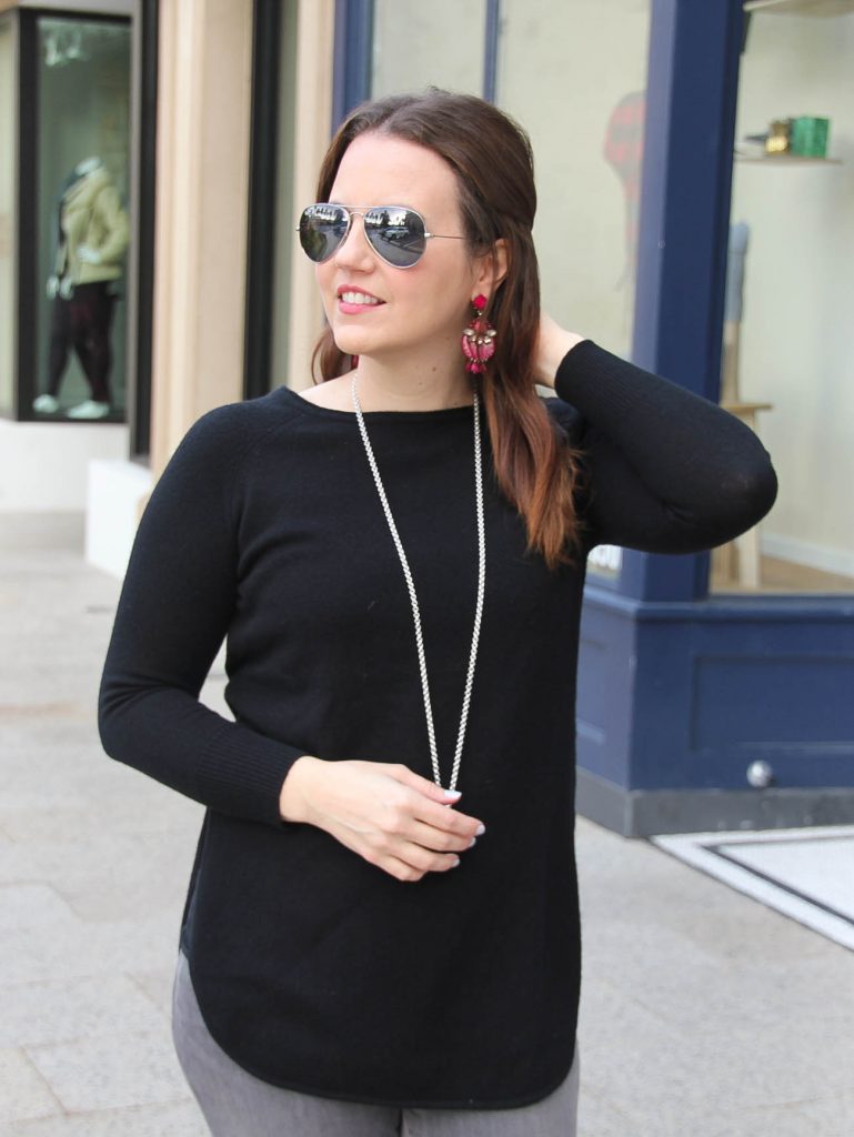 Houston Fashion Blogger wears a black wool cashmere sweater with dark pink statement earrings for a winter outfit idea.