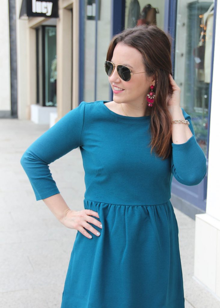 Houston Style blogger Lady in Violet wears the Baublebar Venette drops in berry with the teal ottoman flare dress from Loft.