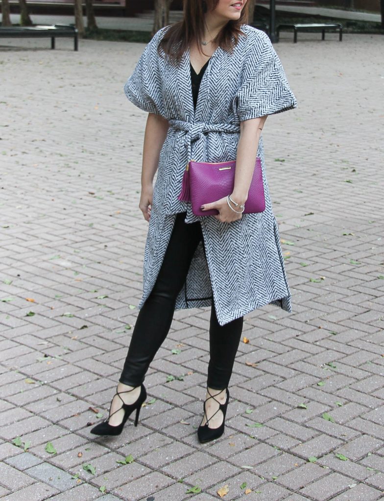 Houston fashion blogger, lady in violet wears a chic holiday outfit with leather leggings and a wrap coat.