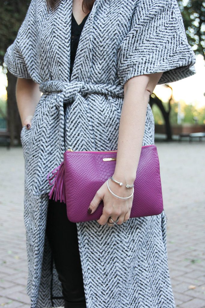 Houston fashion blogger Lady in Violet wears a dao chloe dao wrap coat and gigi ny clutch with the henri bendel bracelet.