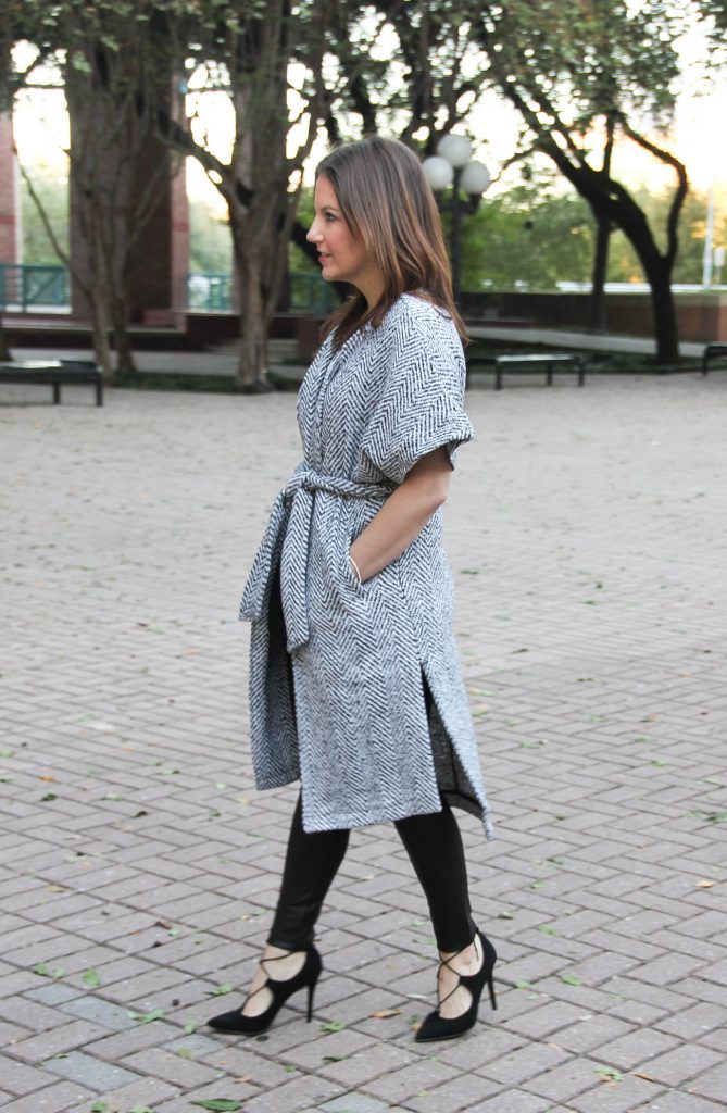 Houston fashion blogger Lady in Violet wears a holiday outfit with a coat, leggings and lace up heels.