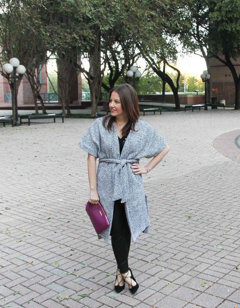 Houston fashion blogger Lady in Violet styles a holiday party outfit idea with coat, faux leather leggings and lace up heels.